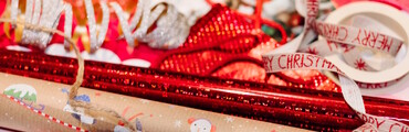 festive gift wrapping with merry christmas ribbon