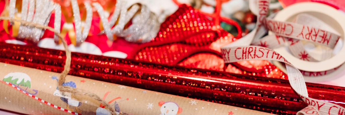 festive gift wrapping with merry christmas ribbon