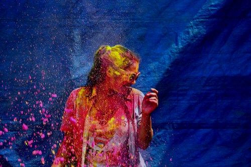 A girl celebrating Holi with colors